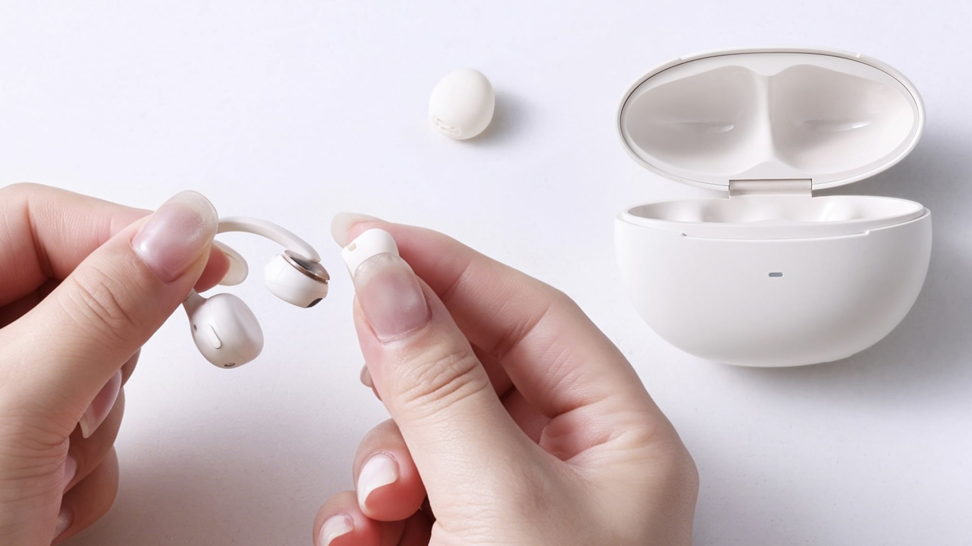pessoa substituindo pontas auriculares em fones de ouvido baseus